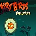 Halloween-teemainen aloitusnäyttö, jossa on keskiöllä kurpitsakuvake ja sanoja Angry Birds Halloween yläpuolella, taustalla siluettipuita yössä