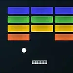 Värikäs palikkarakenne ylhäällä, valkoinen pallo ja alhaalla pienet harmaat suorakulmiot mustalla taustalla, oikeassa alakulmassa punainen Atari-logo