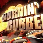 Suuret kolmiulotteiset kirjaimet Burnin Rubber ja autoja näkyvissä taustalla liekkien keskellä