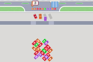 Pienet värikkäät autot järjestettyinä kuvioksi tiellä, joka ylittää suojatien viheralueiden välissä