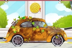 Kuvassa on vanha auto, joka on peitetty syksyn lehdillä ja mudalla