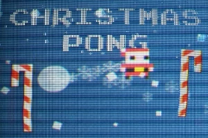 Jouluteemainen pikseligrafiikka, jossa lukee Christmas Pong ja mukana on joulupukin hahmo sekä karkkikepit
