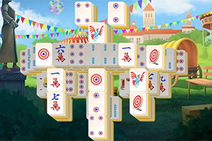 Mahjong-laattoja kasattu ristimuotoon värikkäässä puistoympäristössä, taustalla on liput ja puita
