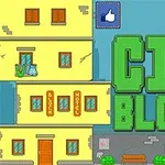 Keltaisen rakennuksen vieressä vihreä CITY BLOCKS -teksti, taustalla sininen taivas