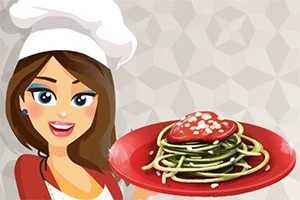 Nainen kokinhatussa hymyilee ja pitelee punaista lautasta, jolla on spagettia ja sydämenmuotoinen kastike