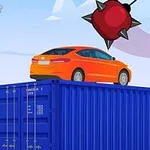 Oranssi auto pysäköitynä sinisen kontin päälle, ylhäällä on piikit sisältävä punainen keinuva pallo