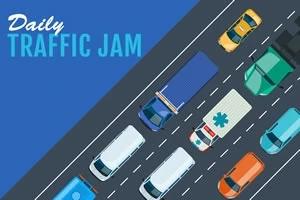 Ilmakuvanäkymä ruuhkaisesta tiestä, jolla on erivärisiä autoja ja ambulanssi