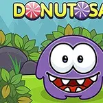 Violetti otus suu auki ja suuret silmät, ympärillä vihreitä pensaita ja taustalla teksti DONUTOSAUR