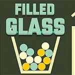Lasin sisälle putoaa erivärisiä palloja, ja ylhäällä lukee FILLED GLASS