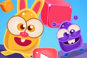Keltainen hahmo, jolla on pupun korvat ja suuret silmät, sekä violetti yksisilmäinen hahmo seisovat värikkäiden palikoiden keskellä sinisellä taustalla
