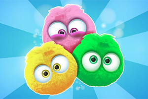 Kolme värikästä, pörröistä hahmoa kirkkaan sinisellä taustalla, yksi keltainen, yksi pinkki ja yksi vihreä