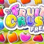 Värikäs teksti Fruit Crush Frenzy ja taustalla erilaisia värikkäitä hedelmiä kuten mansikoita ja omenoita