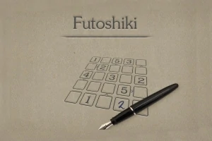 Kynä on ruudukon päällä, jossa on numerot ja teksti Futoshiki taustalla