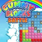 Värikäs peliruutu, jossa on palikoita sateenkaaren ja pilvien ympäröimänä, ja teksti Gummy Blocks Battle