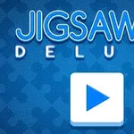 Sinisellä taustalla teksti Jigsaw Deluxe ja nuoli-painike keskellä