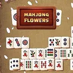 Pelilauta, jossa on erilaisia mahjong-laattoja, ympärillä vaaleanpunaisia kukkia
