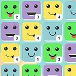 Värikkäät hymiökuutiot numeroilla peliruudukossa