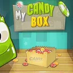 Vihreä hymyilevä hahmo, karkkipussi täynnä karkkeja ja teksti My Candy Box värikkäällä taustalla