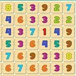 Värikkäitä numeroita järjestettyinä ruudukkoon beigeillä taustoilla