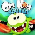 Vihreä hahmo hymyilee ja pitää vaaleanpunaista karkkia muiden hahmojen ympäröimänä värikkäässä ympäristössä, jonka yläosassa on teksti Om Nom Bounce