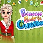 Kaksi prinsessaa jouluisissa asuissa vihreällä koristellulla taustalla, jossa on teksti Princess Ready for Christmas