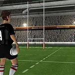 Mies mustassa peliasussa seisoo rugby-kentällä pitelemässä palloa maalitolppien edessä