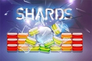 Kuvassa on värikkäitä lasimaisia palikoita, jotka ovat murtumassa, ja niiden yläpuolella teksti SHARDS