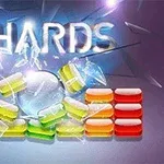 Kuvassa on värikkäitä lasimaisia palikoita, jotka ovat murtumassa, ja niiden yläpuolella teksti SHARDS