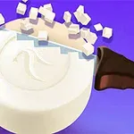 Veitsi leikkaa pyöreää valkoista kappaletta kuutioiksi violetilla taustalla