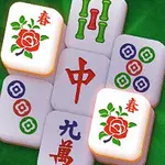 Mahjong-laattoja vihreällä taustalla, joissa on punaisia ja sinisiä kukka- ja symbolikuvioita
