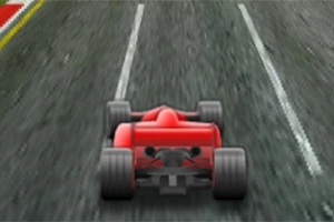 Punainen formula-auto ajamassa pitkin asfalttista kilparataa