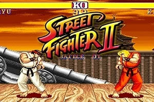 Kaksi hahmoa taistelee areenalla, jonka yläpuolella on teksti Street Fighter II