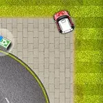 Punainen auto ajautuneena jalkakäytävälle lähellä rahatukkoa ruohikkoisen alueen vieressä