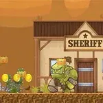 Cowboy ampuu vihreää hirviötä sheriffin toimiston edessä autiomaassa kultakolikoiden ympäröimänä