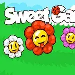 Neljä värikästä, hymyilevää kukkaa vihreällä nurmella, taustalla sininen taivas ja valkoiset pilvet, yläosassa teksti Sweet Garden
