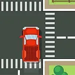 Risteys, jossa punainen ja oranssi auto kulkevat suojateiden ympäröimänä
