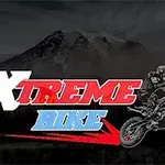 Motocross-kuljettaja hyppää motoristossa tummalla vuoristotaustalla, ja edessä on teksti Xtreme Bike