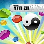 Yin ja yang -symboli sateenkaaren väreissä hehkuvien jalokivien keskellä